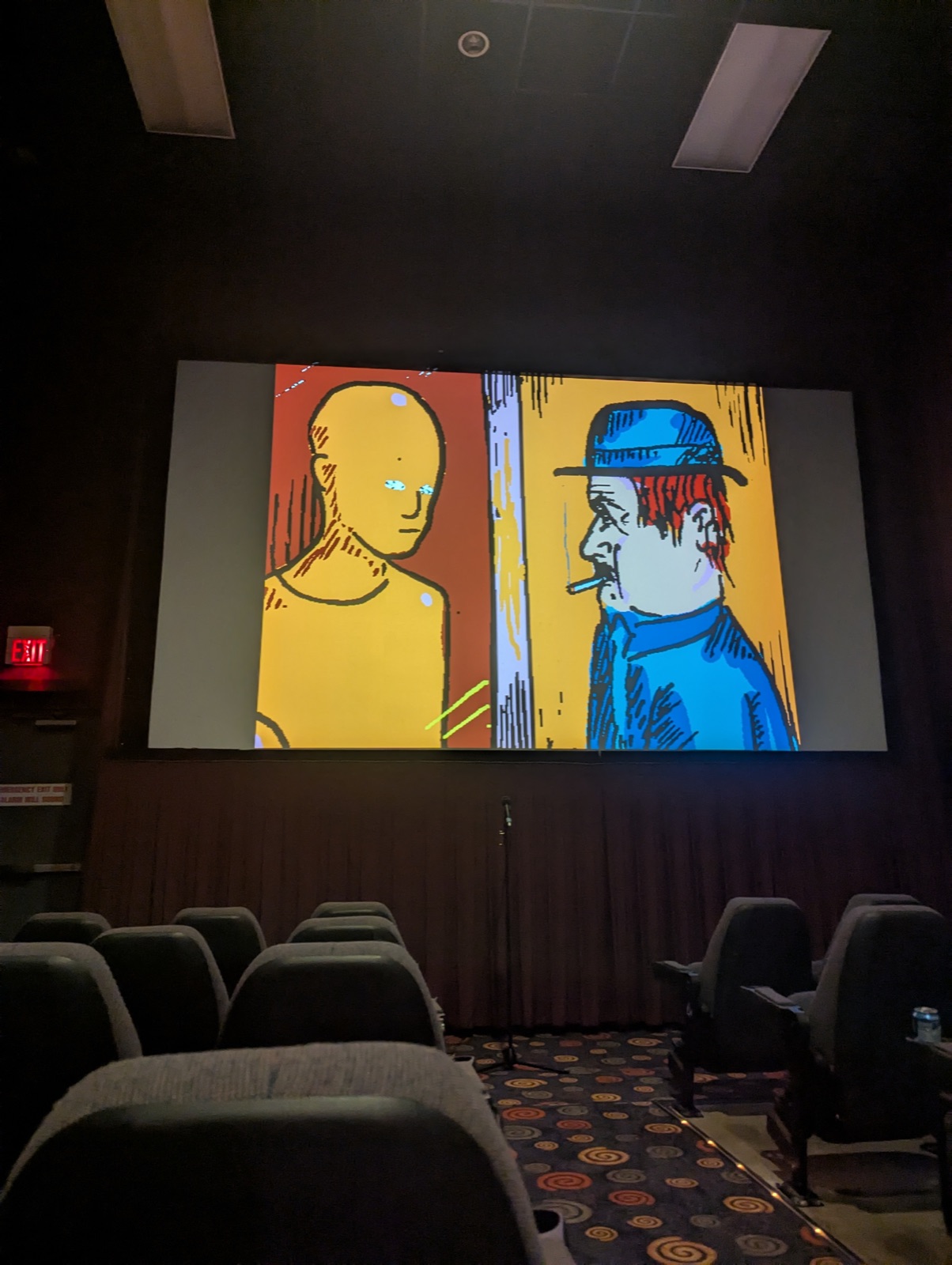 Interface playing on the Esquire's screen during the projection check, two hand-drawn figures facing each other, the room still empty